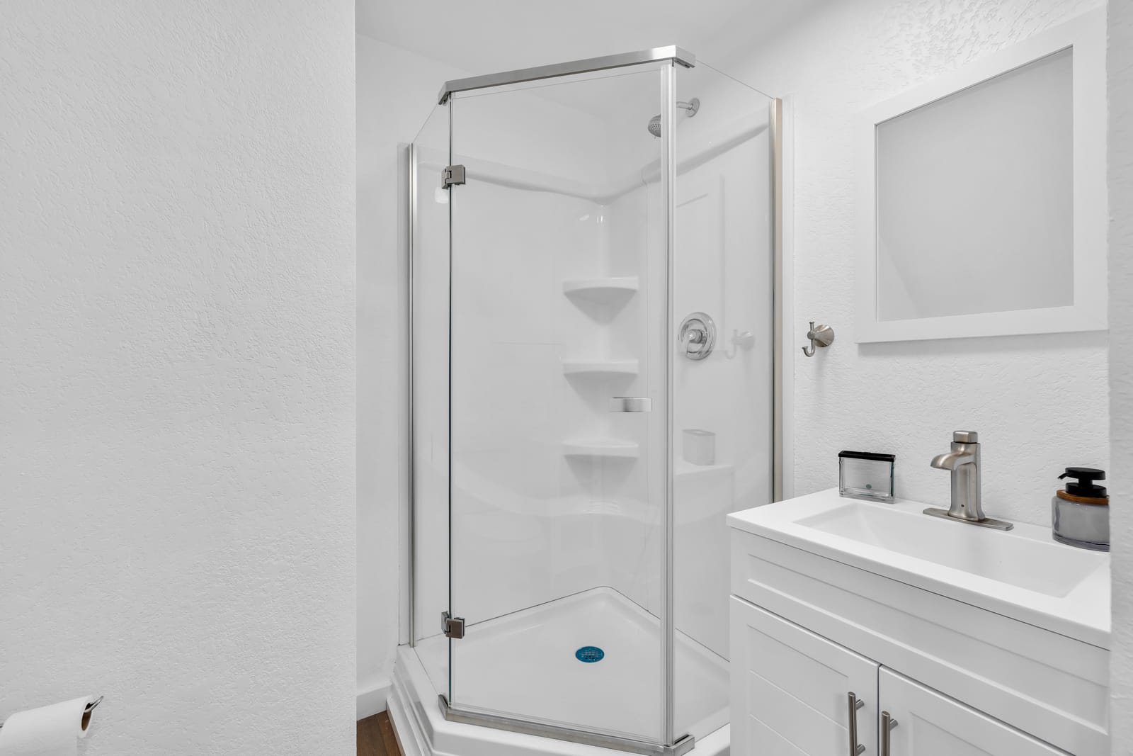 Clean residential bathroom with a walk-in shower at New Frontier Recovery Center in Huntley, Montana